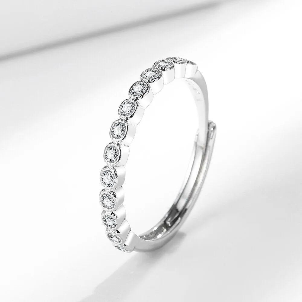 Women's geometric diamond tail ring in electroplated copper, shown in white gold colour and yellow gold colour finishes.