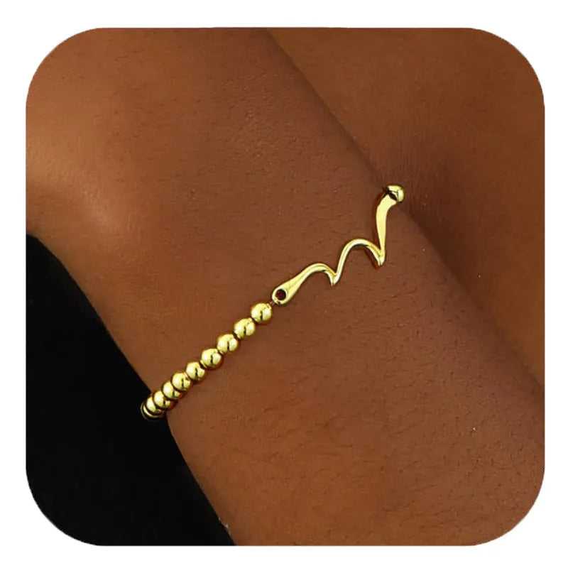 Adjustable stainless steel beaded bracelet with round beads in a simple geometric design.