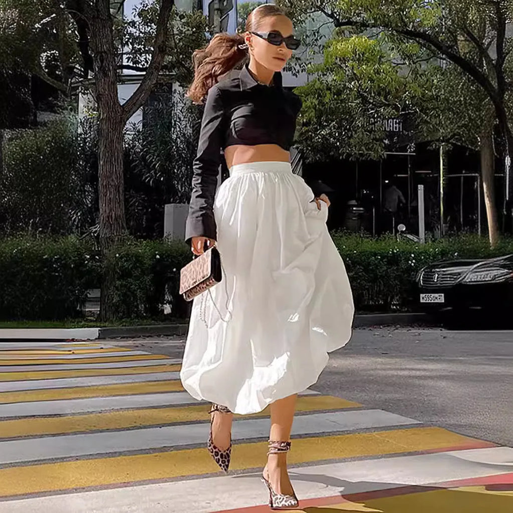 Women's cotton long skirt in solid black or white colour with office-appropriate styling