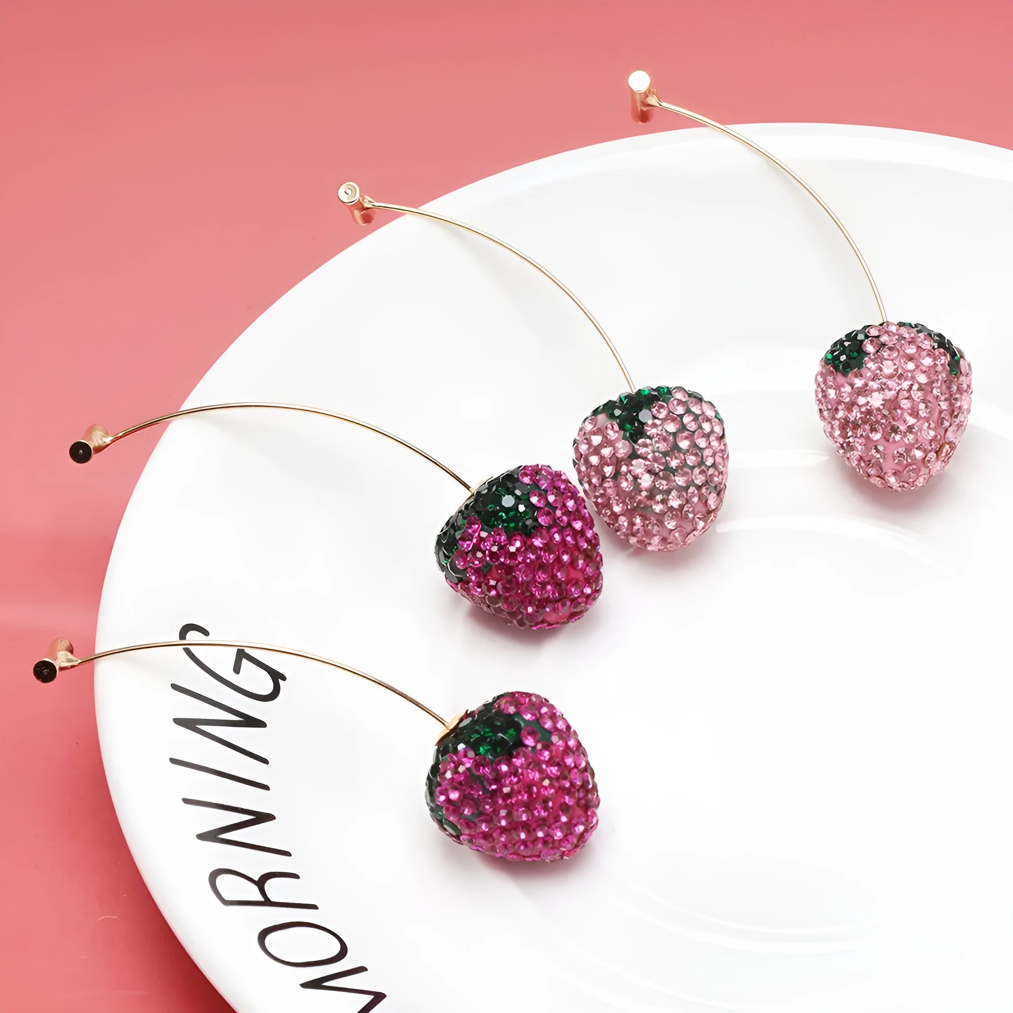 Geometric zinc alloy strawberry earrings for women with spot drill texture in red, pink, purple, champagne, pink & white, and white powder.
