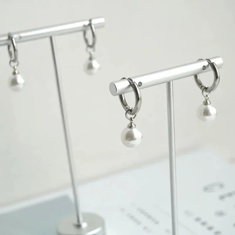 Alloy pearl earrings with geometric round drop design and titanium steel construction
