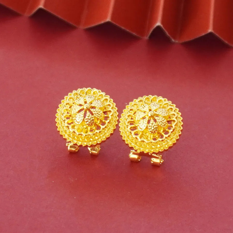 Gold-coloured three-piece jewellery set showing necklace with water wave chain, floral design earrings, and matching ring.