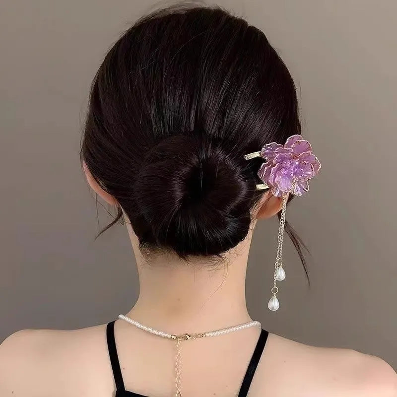 Close-up of a retro U-shaped alloy hairpin with a purple peony flower and tassel design.