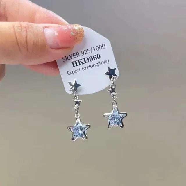 Alloy heart-shaped geometric ear clip with rhinestone detailing and star tassels