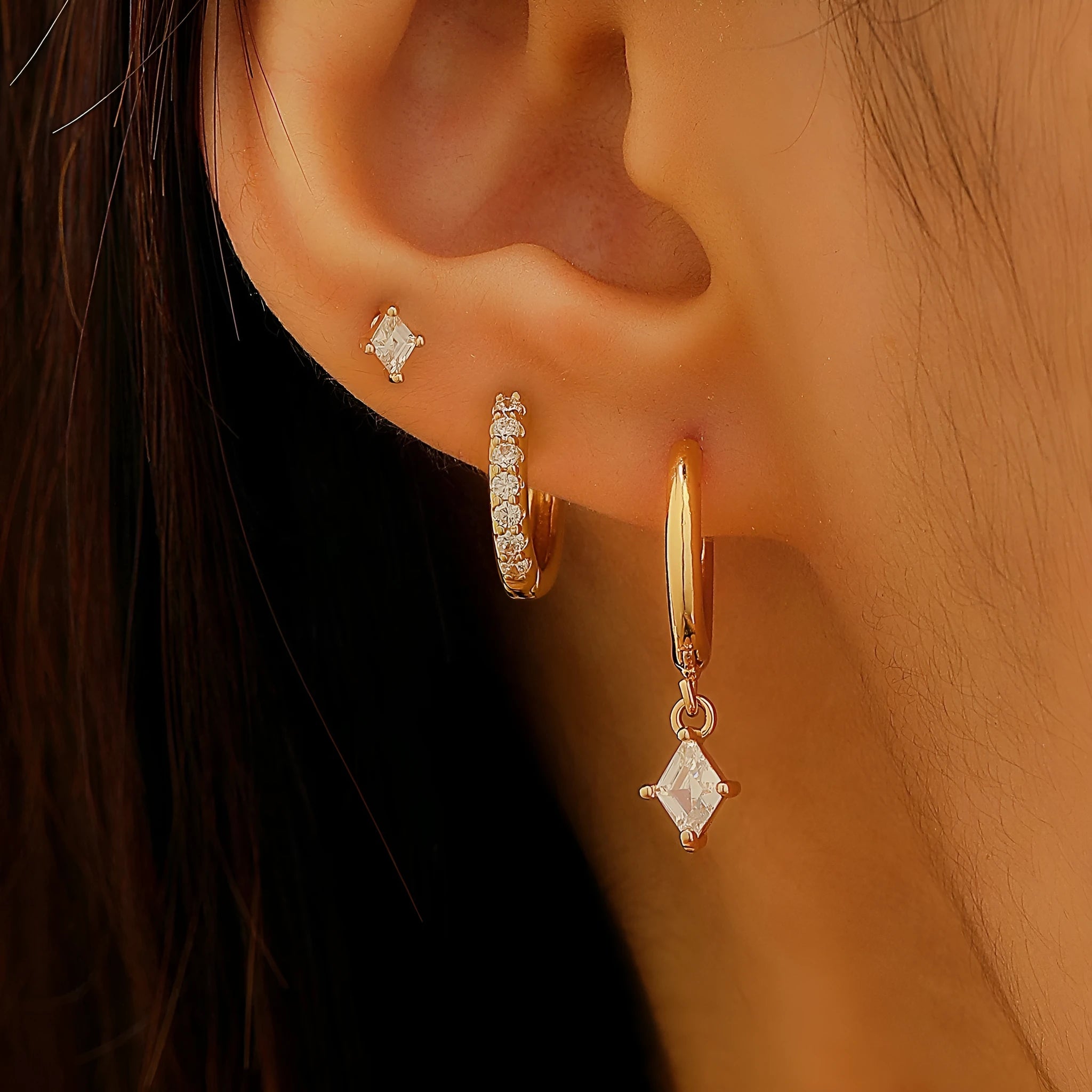 Ladies three-piece zircon inlaid geometric earring set with pendant, stud and clip styles in gold finish