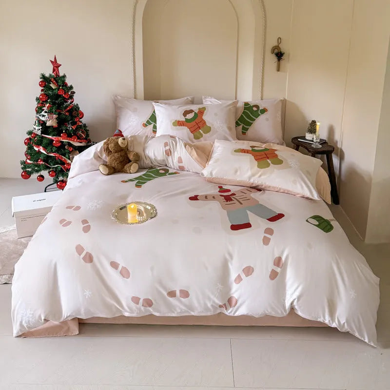 Christmas cartoon print bedding four-piece set on a bed, showing duvet cover and pillowcases.