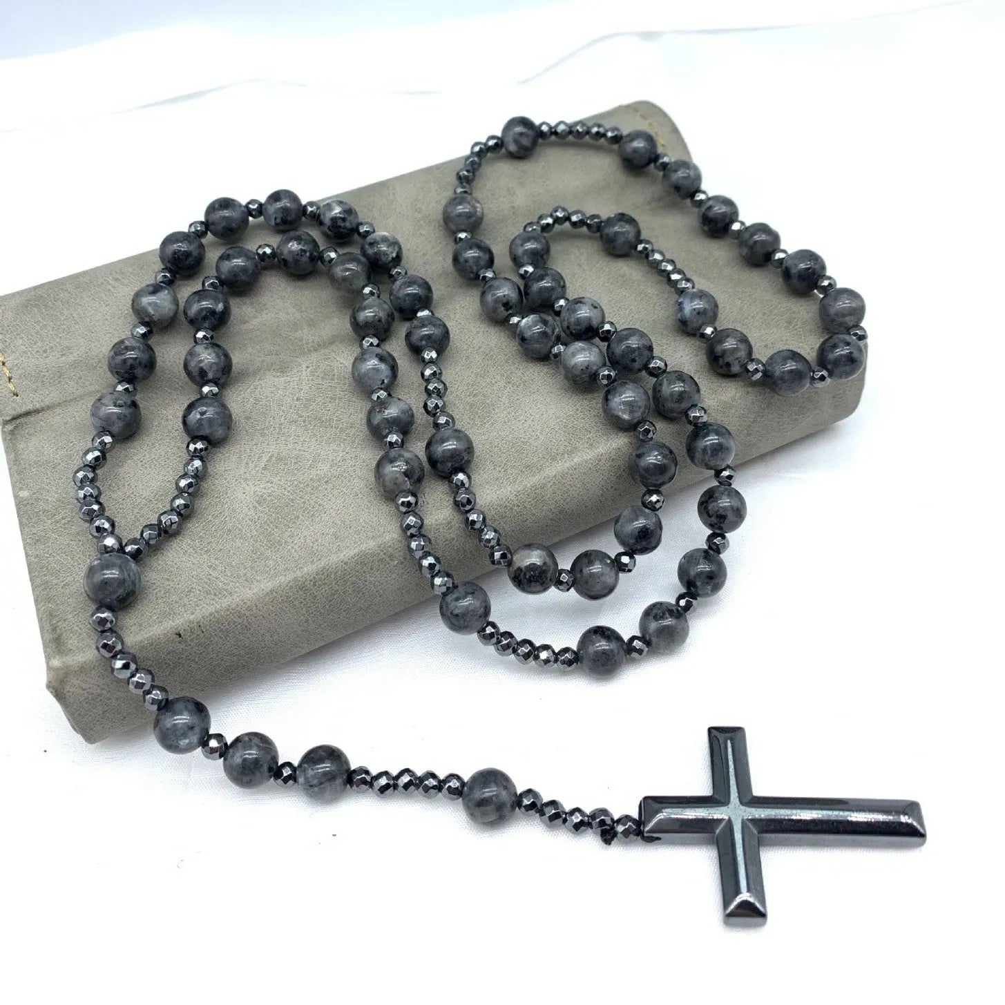 Men's stone cross pendant necklace with hand-woven detail on ball bead chain