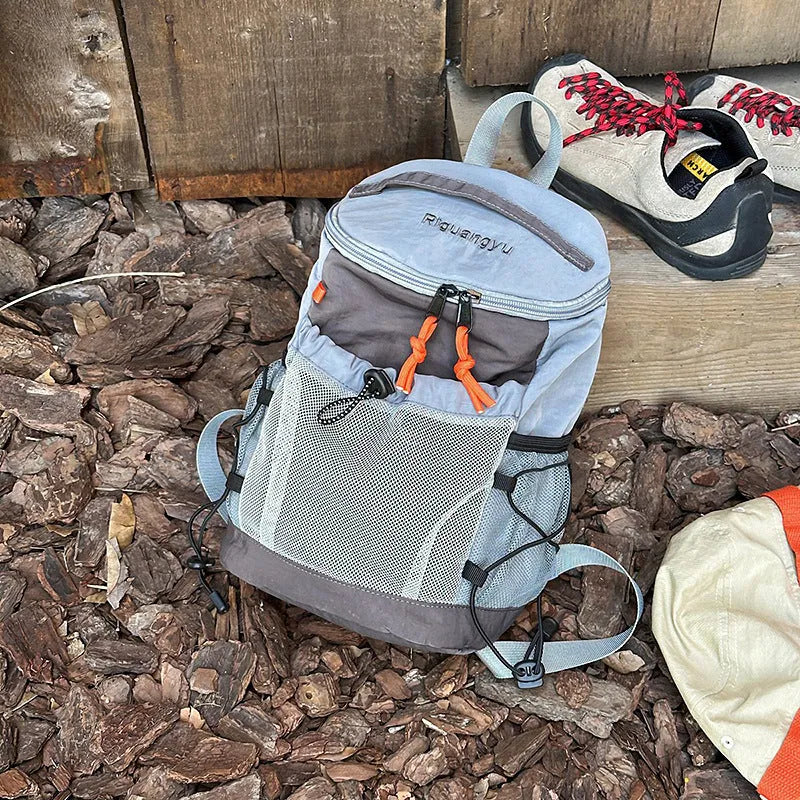 Japanese style casual backpack in waterproof nylon with a curved shoulder strap, shown in a solid colour.