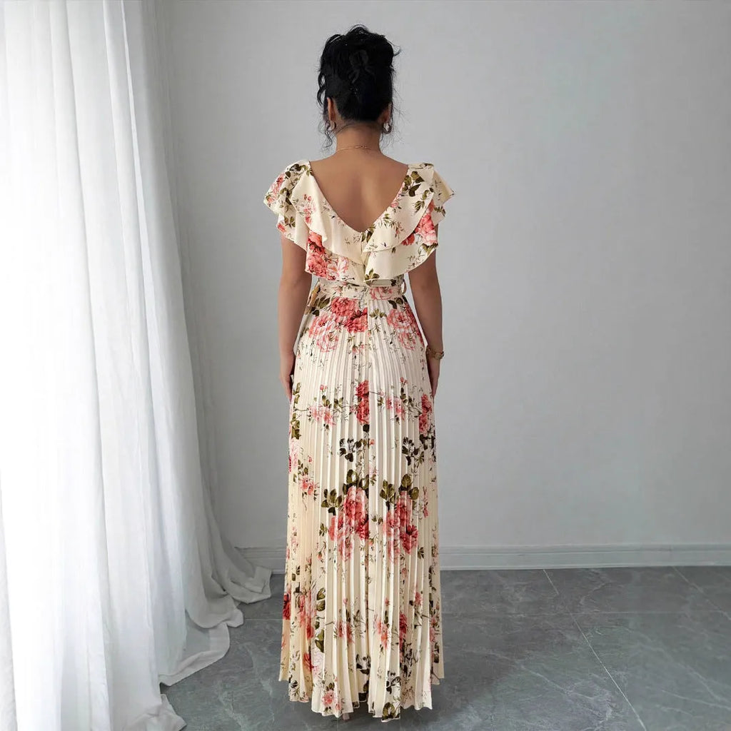 Apricot colour dress with digital floral print, V-neck, ruffled short sleeves, and a high-waisted oversized swing skirt.