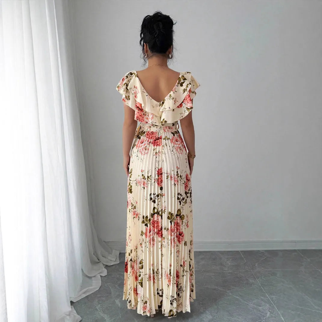 Apricot colour dress with digital floral print, V-neck, ruffled short sleeves, and a high-waisted oversized swing skirt.