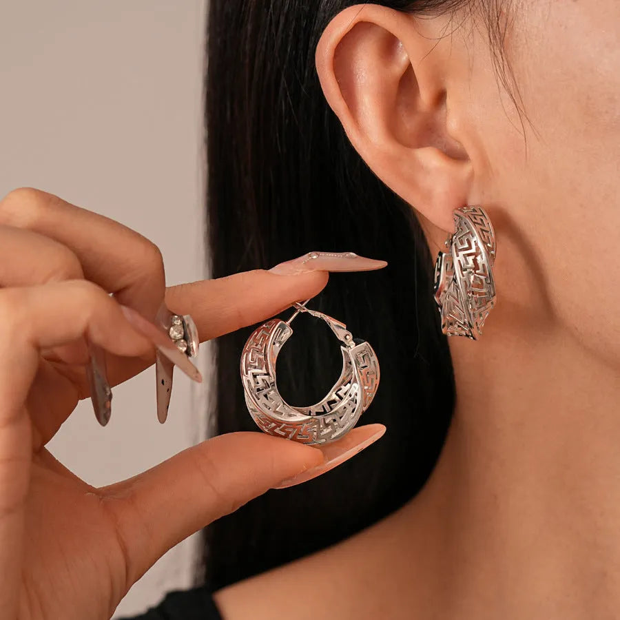 Women's geometric hollow stud earrings with twisted round design in electroplated copper
