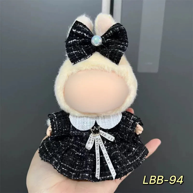 Plastic doll costume outfit designed for 17cm tall vinyl figurines on a display stand.