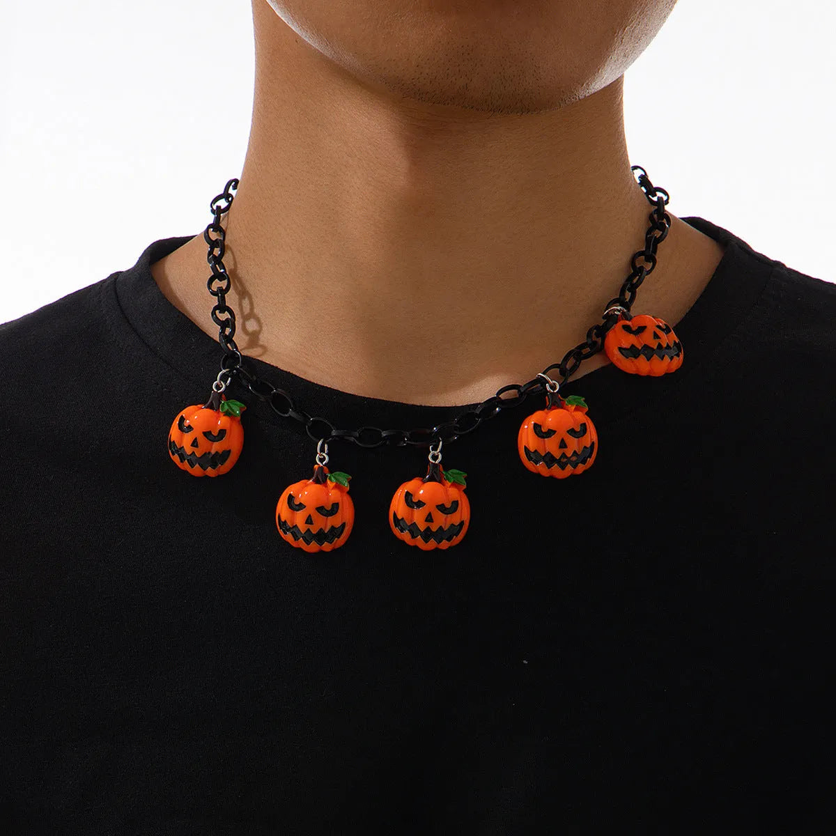 Mixed colour ghost pumpkin acrylic necklace on a regular chain, cartoon Halloween styling.