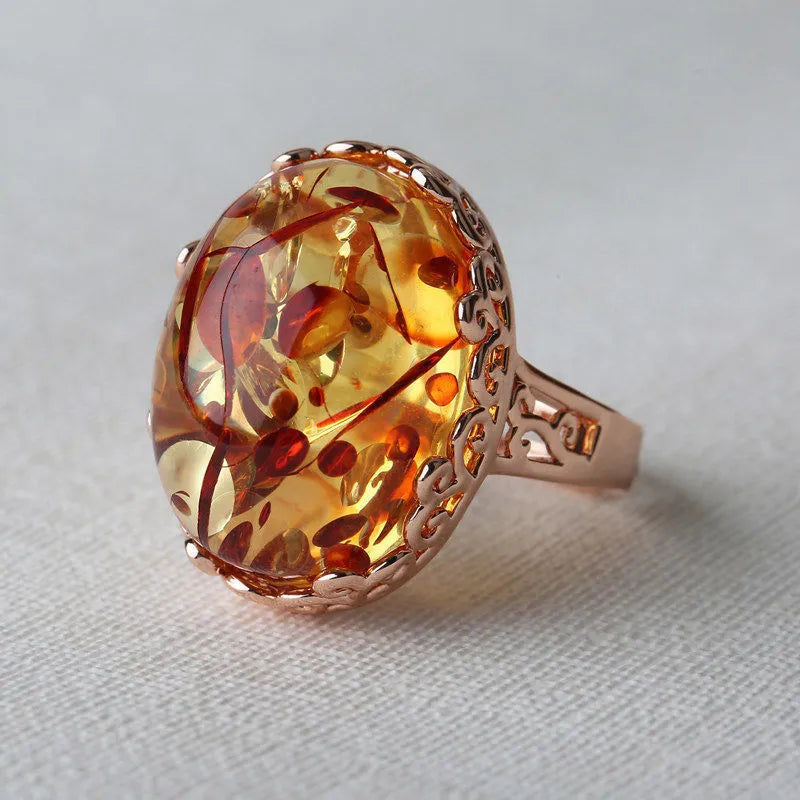 Amber beeswax ring in New Amber Type A colour on alloy band with ethnic retro design