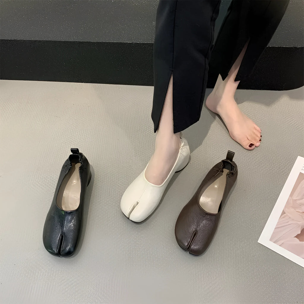 Women's apricot coloured chunky low heel pumps with round toe and split toe horseshoe design detail.