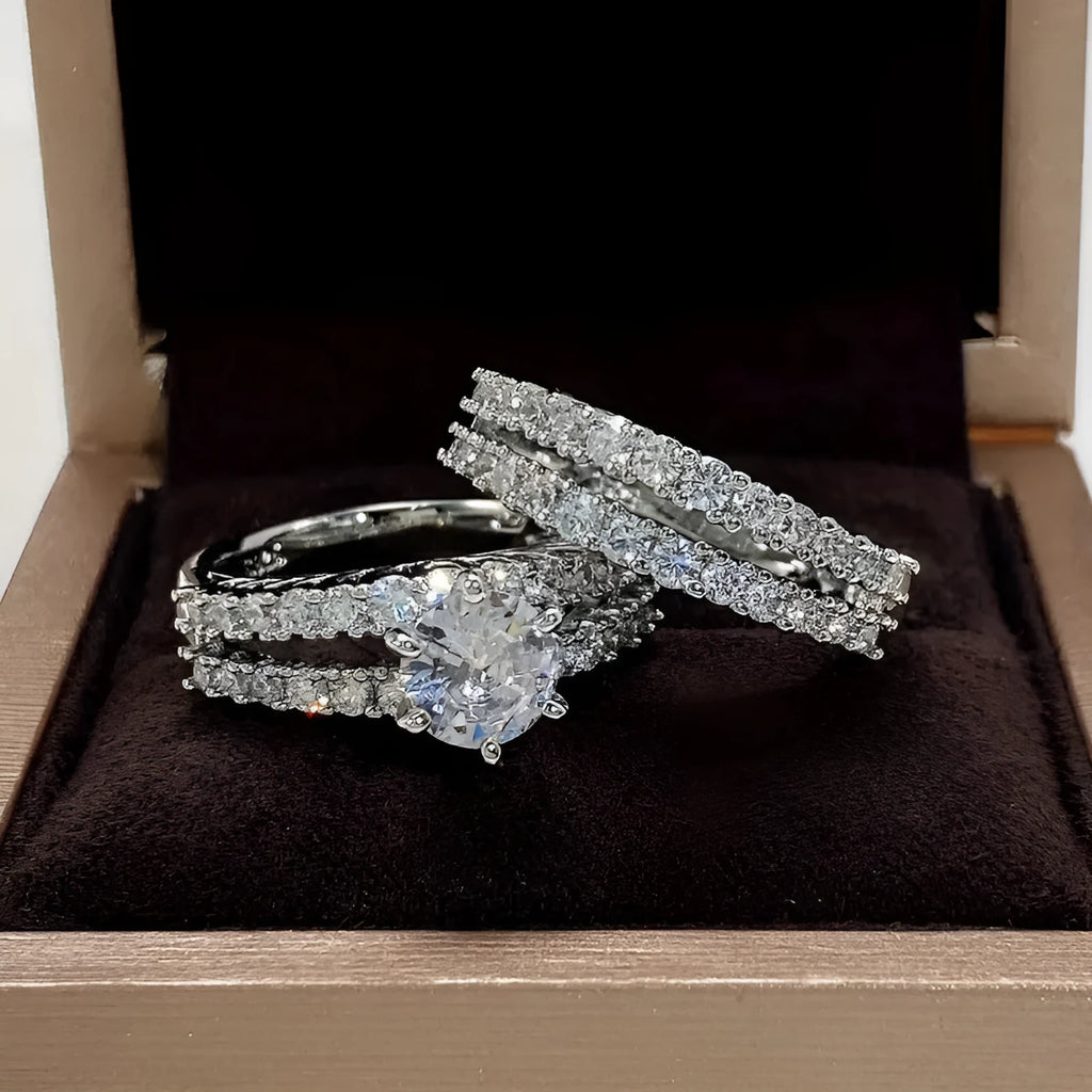 Geometric fully-jewelled female ring set in silver, gold, and rose gold colour options on a size chart.