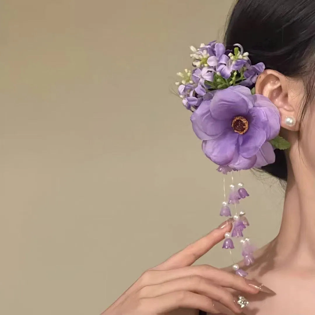 Yellow and purple floral tassel side clip hair accessory for women.