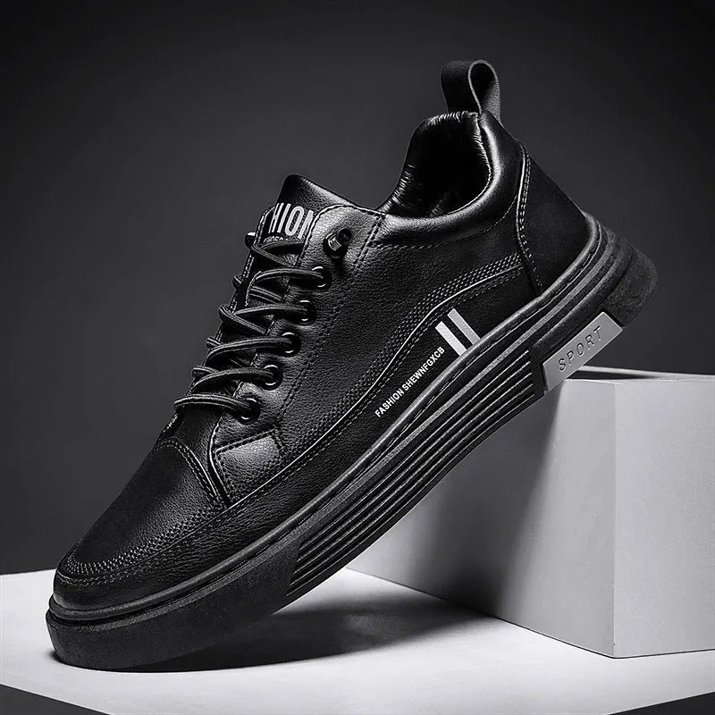 Men's white low-top skate shoes with elastic band and round toe, on a plain background.