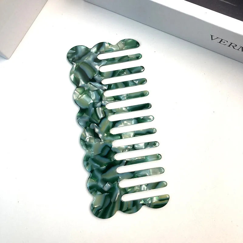 Acetate board geometric wave hairdressing comb for women in pink colour, showing wave shape and lightweight construction