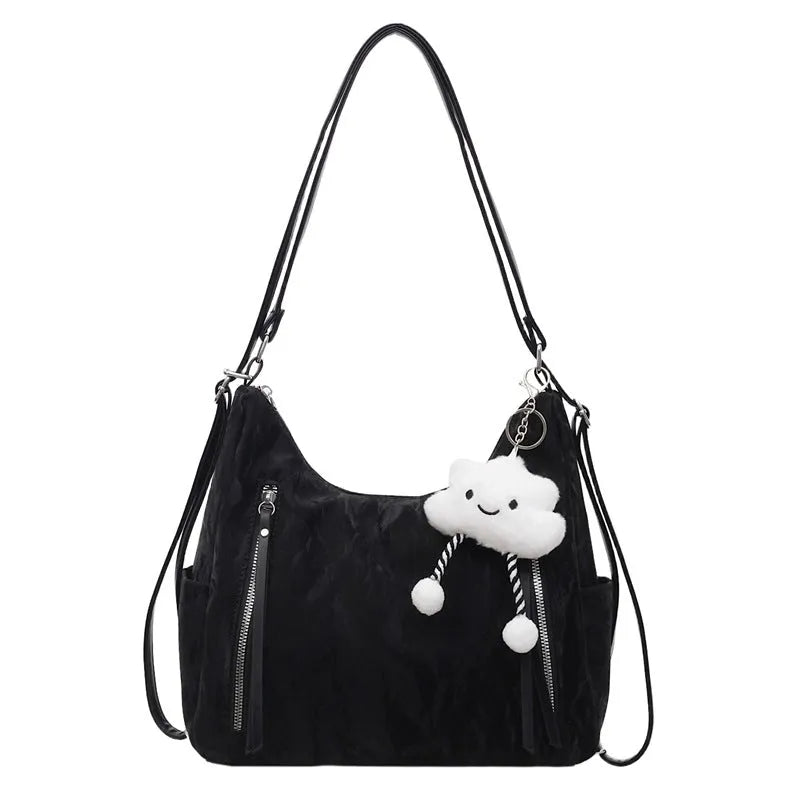 Women's soft PU fashion backpack in multiple colours showing backpack and shoulder bag carrying options with pendant accessory