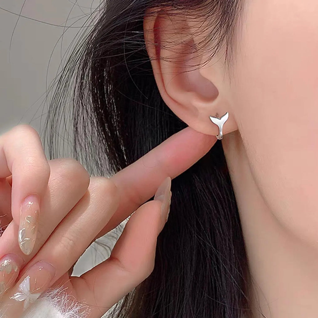 Women's fishtail earrings in copper with electroplated gold finish, simple all-match design