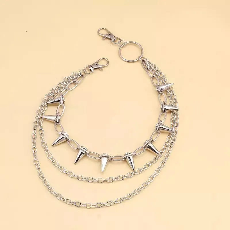 Silver metal double layer pants chain with rivet ornaments on dark trousers
