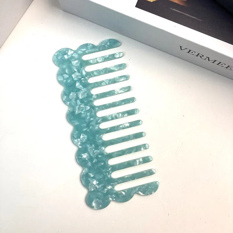 Acetate board geometric wave hairdressing comb for women in pink colour, showing wave shape and lightweight construction
