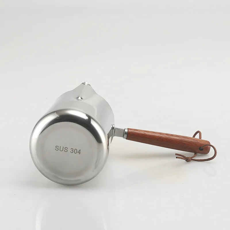 Stainless steel coffee cup with wooden handle and interior measuring scale