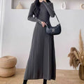 Women's beige A-line knit skirt with high waist, shown below the knees.