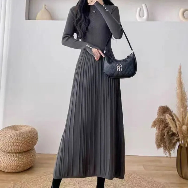 Women's beige A-line knit skirt with high waist, shown below the knees.