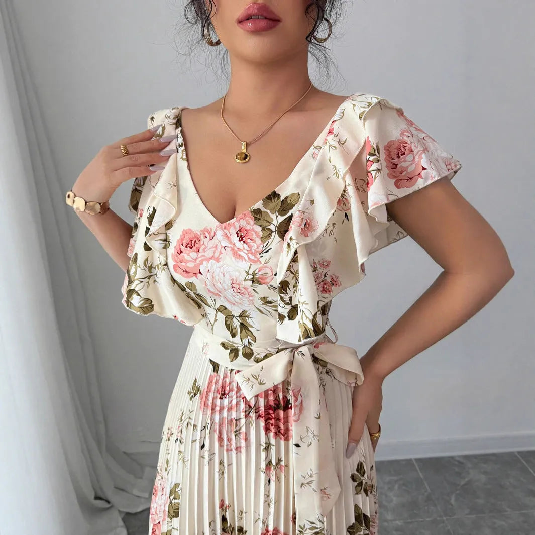 Apricot colour dress with digital floral print, V-neck, ruffled short sleeves, and a high-waisted oversized swing skirt.