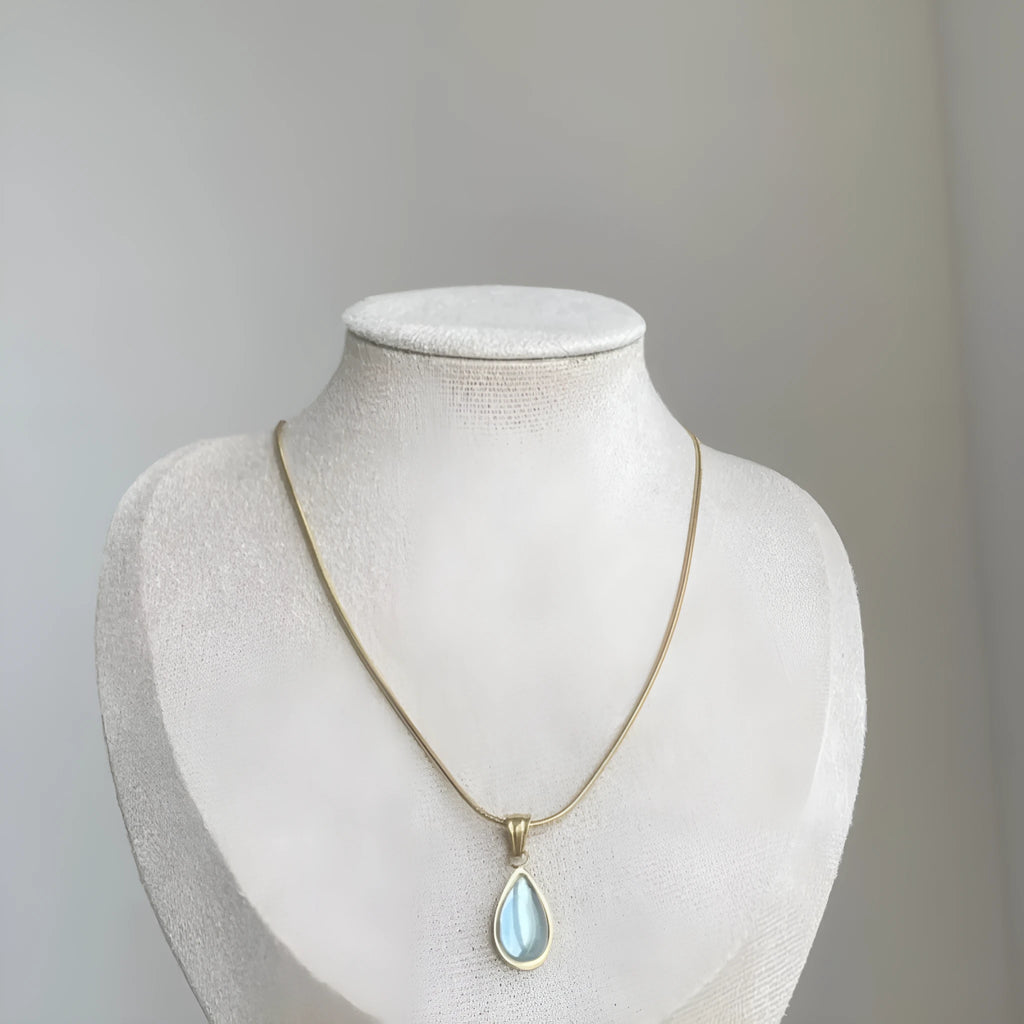 Retro water drop necklace with mixed gem inlaid pendant on a titanium steel snake chain in blue and green colour options.
