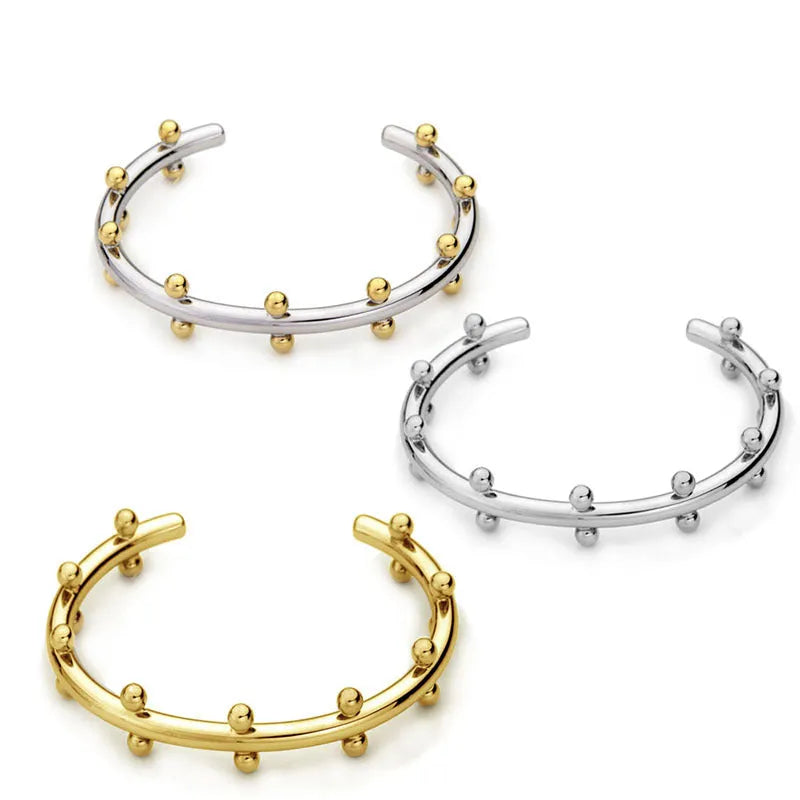 Stainless steel C-shaped bean bead bracelet with textured rivet detailing and alloy chain in three colour options