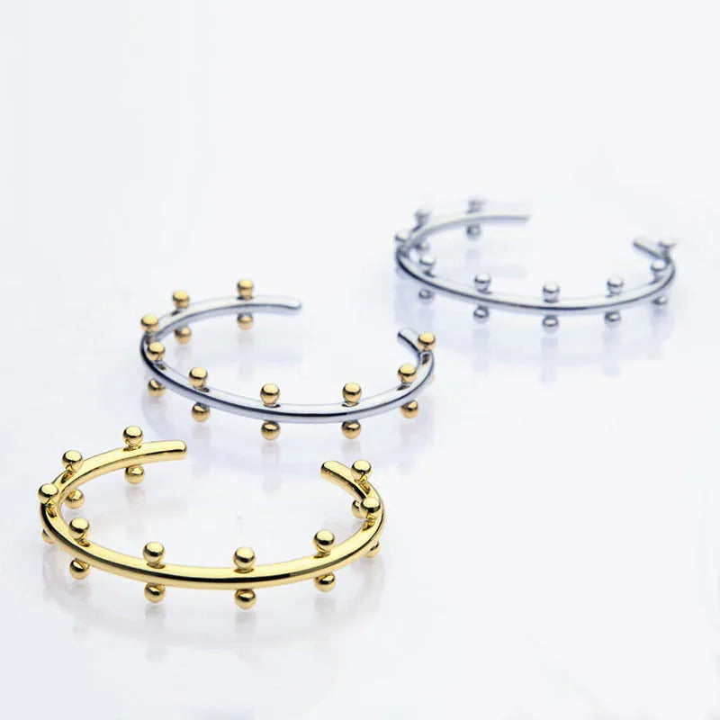 Stainless steel C-shaped bean bead bracelet with textured rivet detailing and alloy chain in three colour options
