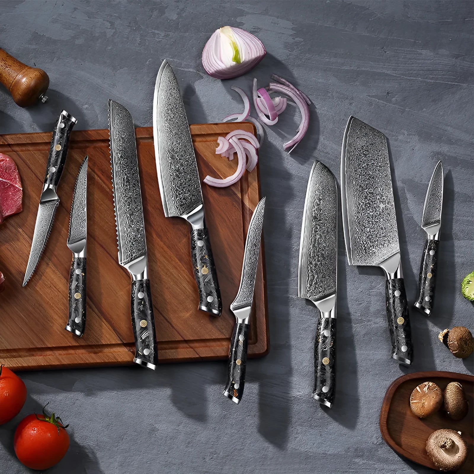 Damascus steel 8-piece kitchen knife set showing fishbone pattern on blades