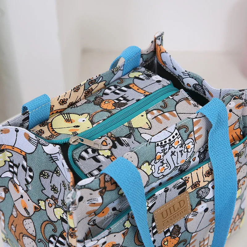 Women's printed canvas handbag with aluminium hardware showing floral design options
