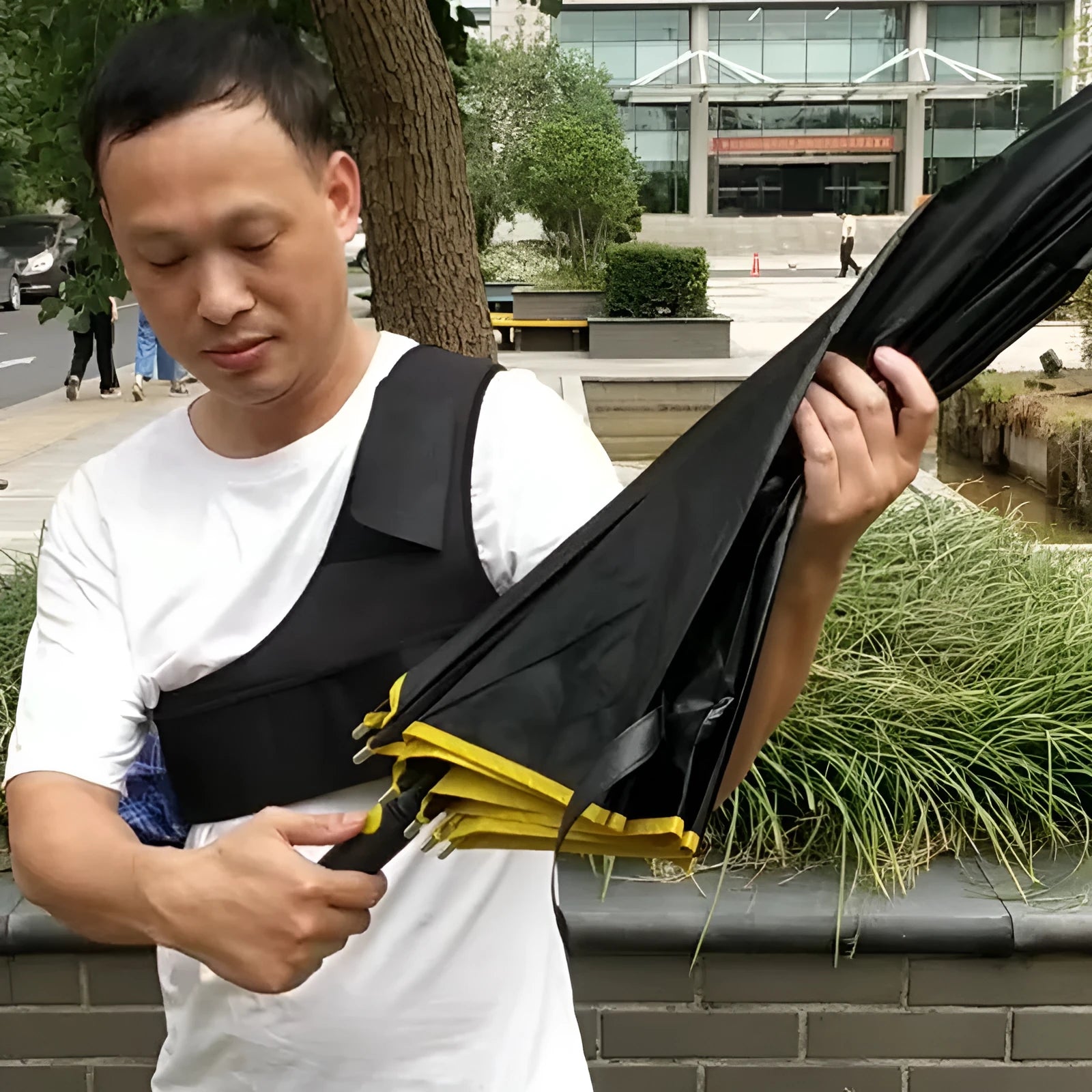 Portable umbrella holder with shoulder strap in diving cloth fabric showing black and grey colour options