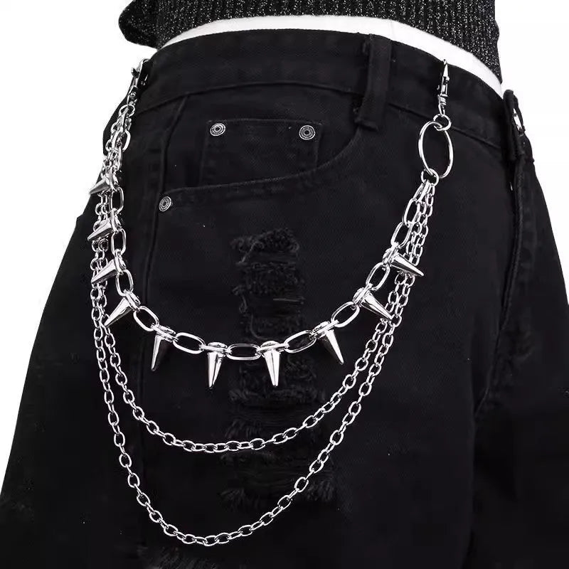 Silver metal double layer pants chain with rivet ornaments on dark trousers