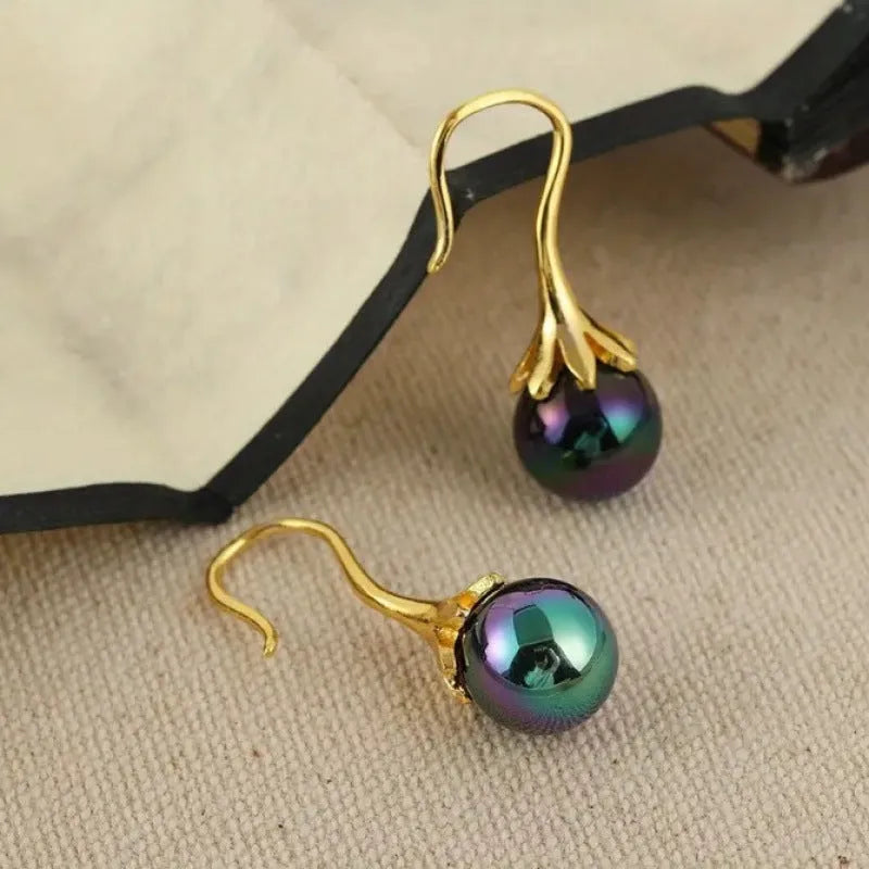 A pair of retro-style women's earrings with an electroplated imitation gold finish