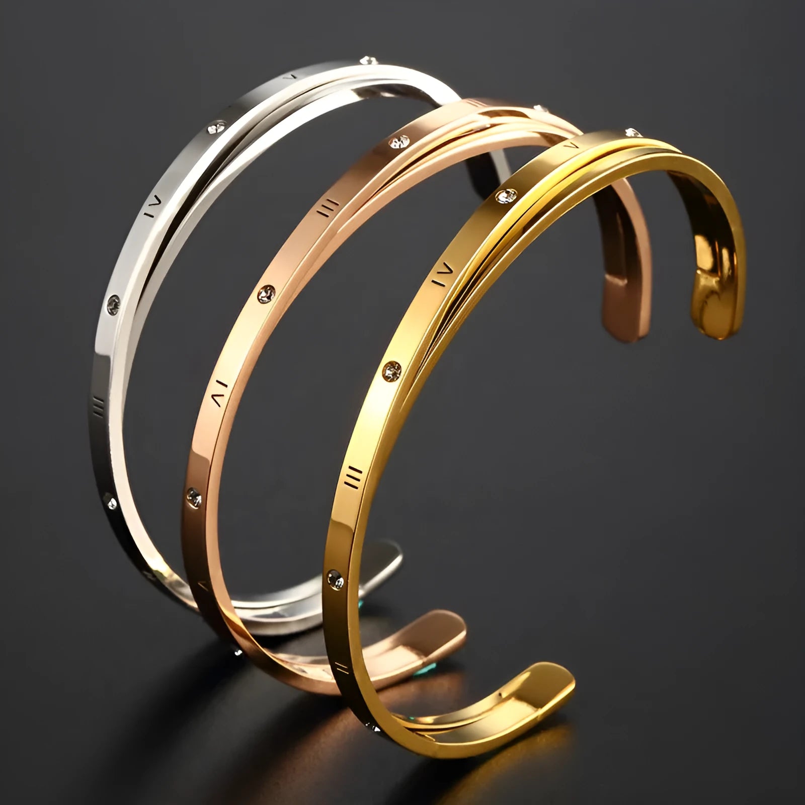 Open-ended stainless steel bracelet with zircon detailing showing rose gold, gold and steel colour options
