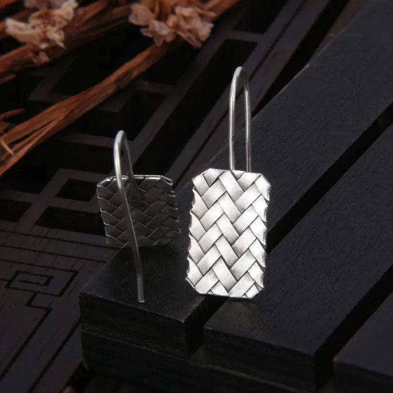 Geometric diamond plaid pattern earrings made from silver-coloured 925 silver.