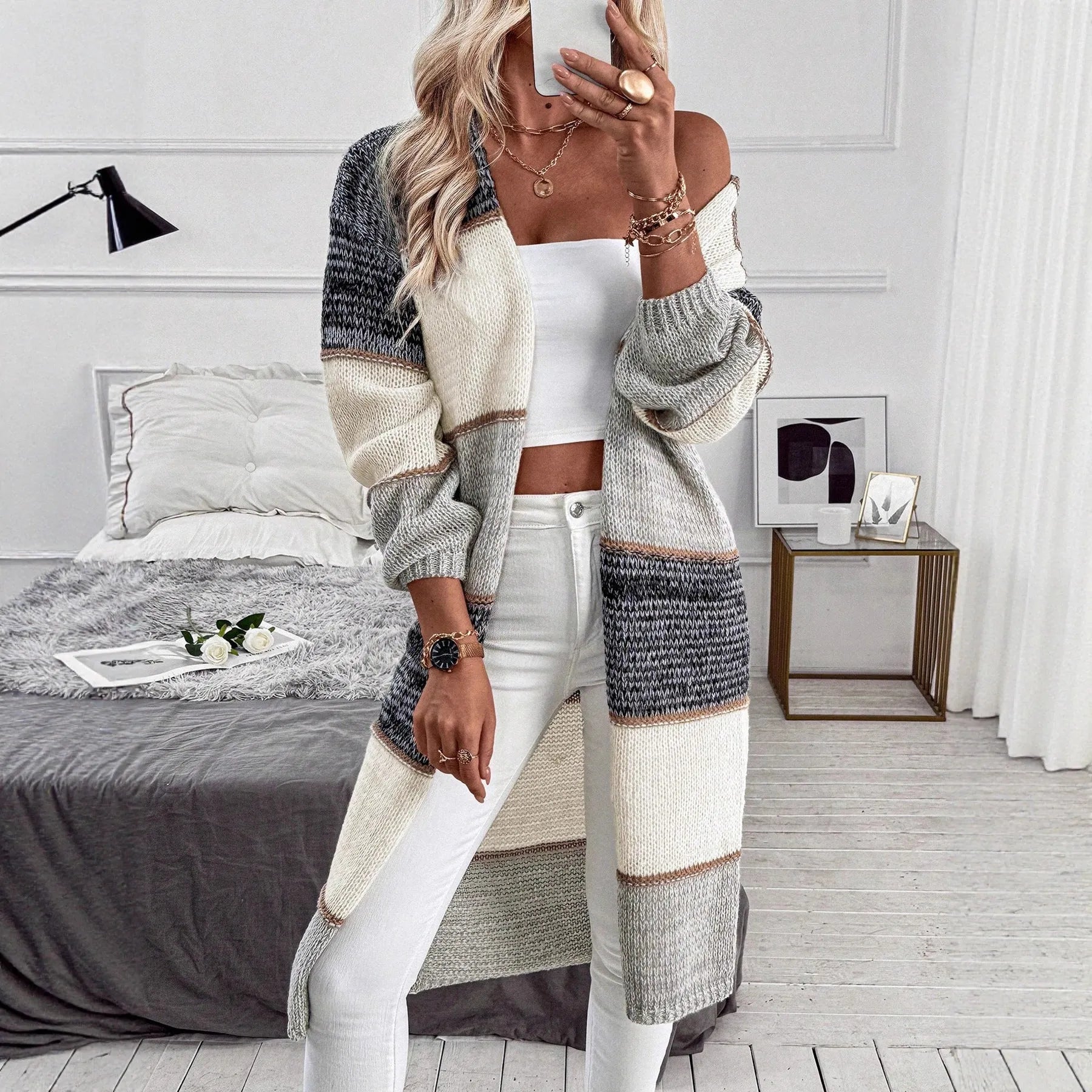 Grey loose-fit long sleeve knitted cardigan coat on a hanger