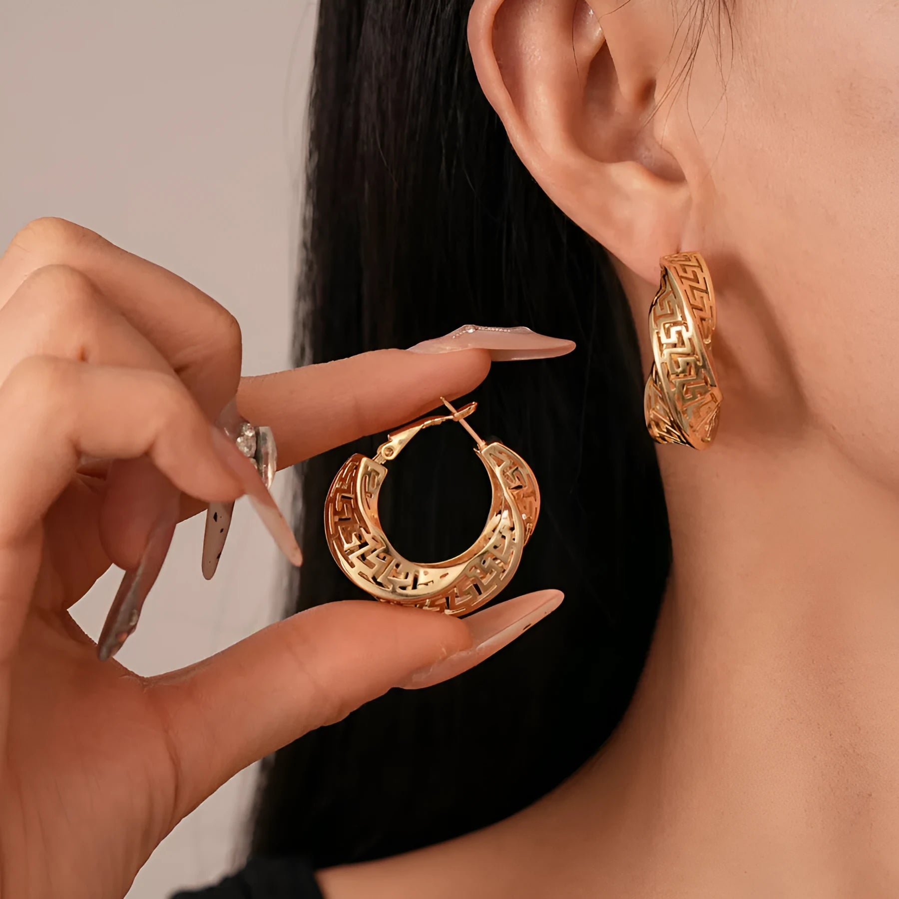 Women's geometric hollow stud earrings with twisted round design in electroplated copper