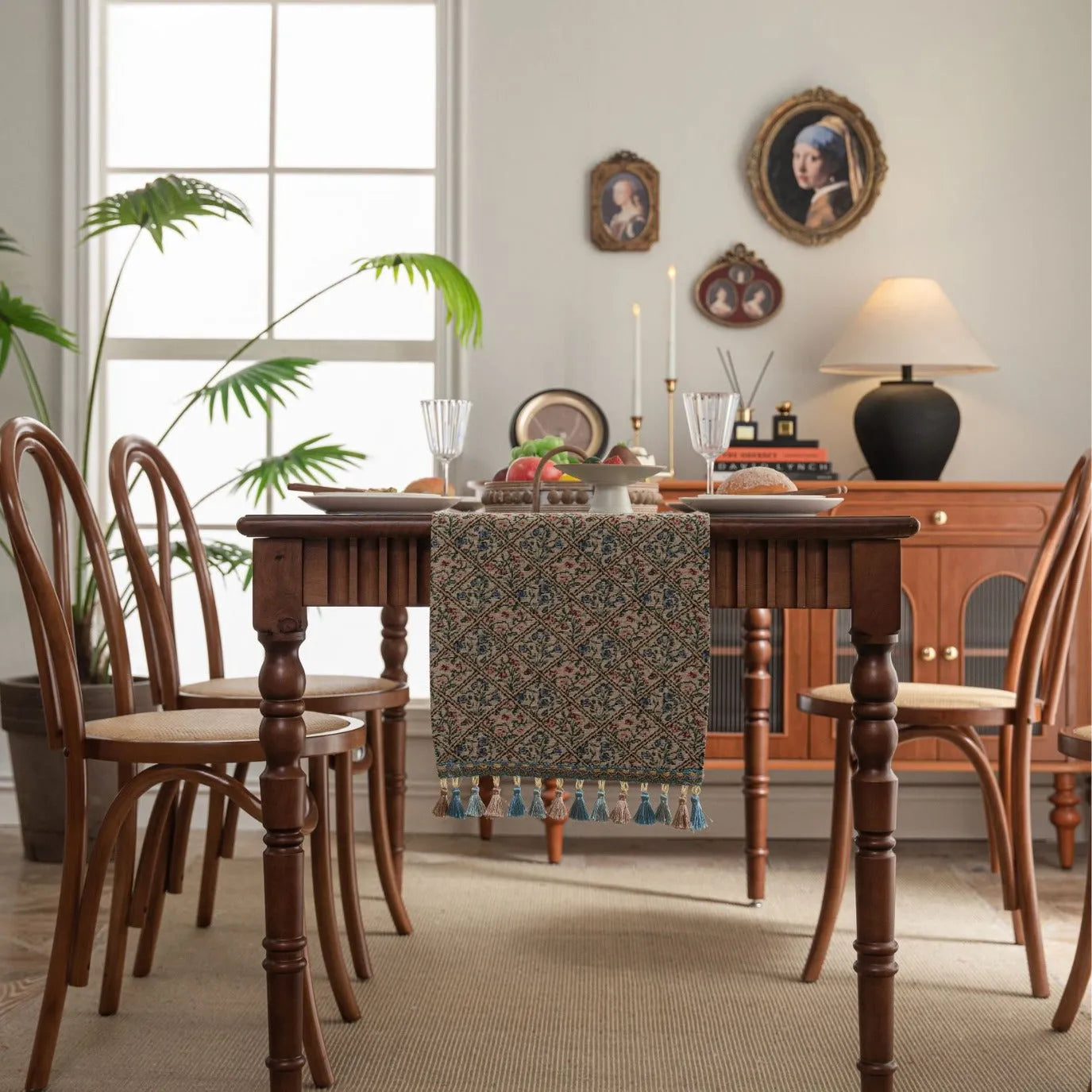 Nordic jacquard table runner with tassel trim in dark blue striped pattern laid on a wooden table.