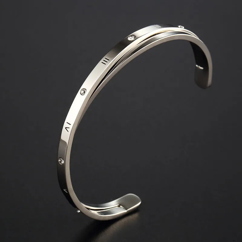 Open-ended stainless steel bracelet with zircon detailing showing rose gold, gold and steel colour options