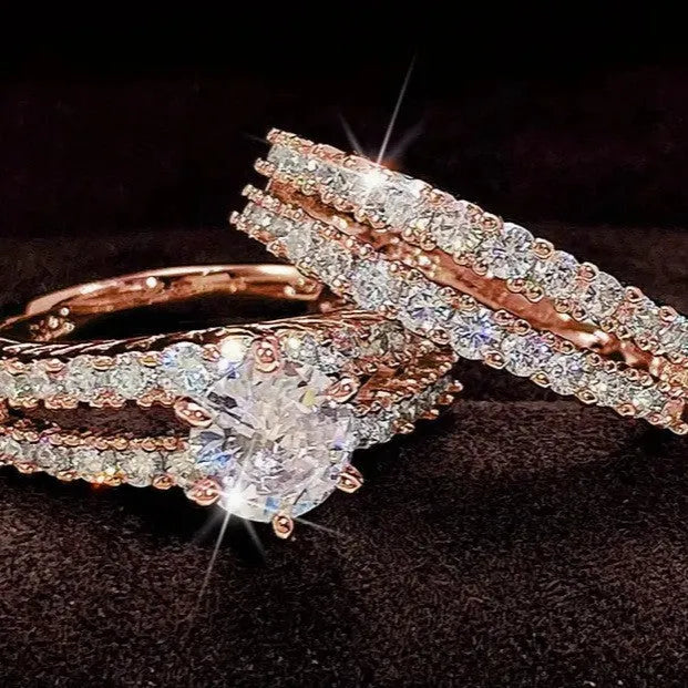 Geometric fully-jewelled female ring set in silver, gold, and rose gold colour options on a size chart.