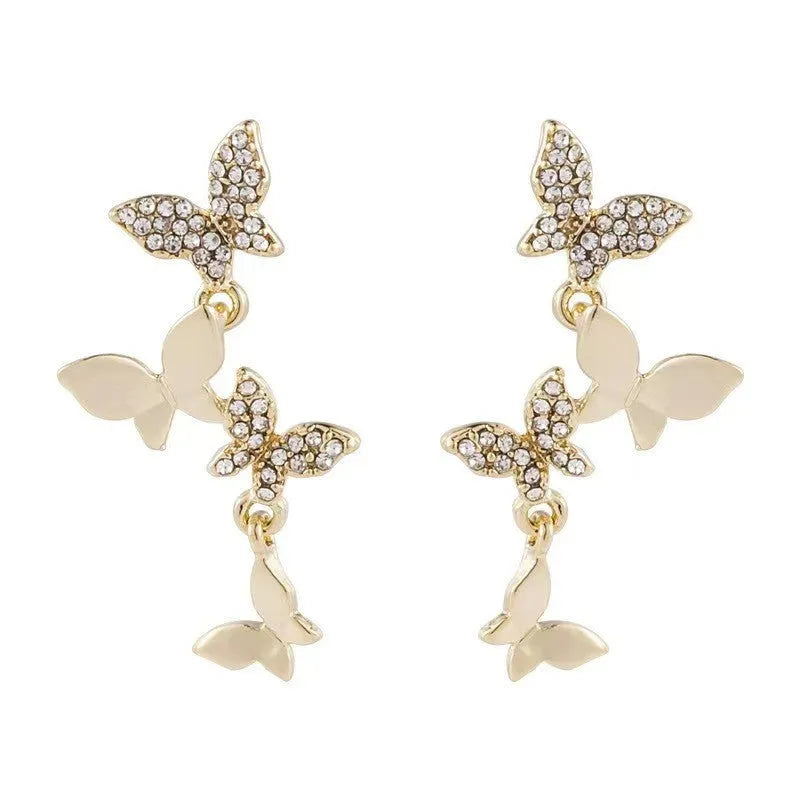 Women's copper butterfly drop earrings with four-butterfly design and gold-coloured finish