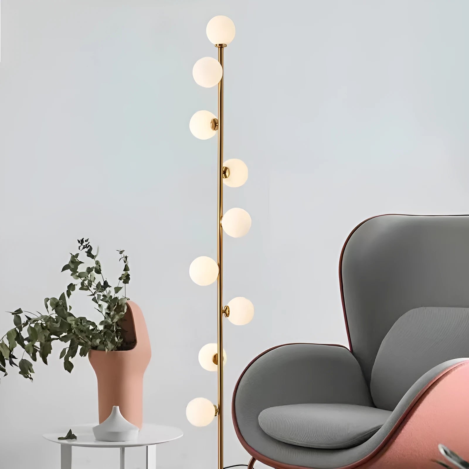 Minimalist modern floor lamp with wrought iron and glass construction, marble base, and adjustable light colours.