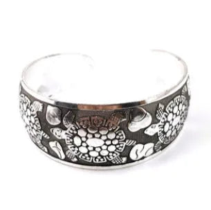 Silver Miao ethnic carved openwork Roman bracelet with elephant motif on alloy material