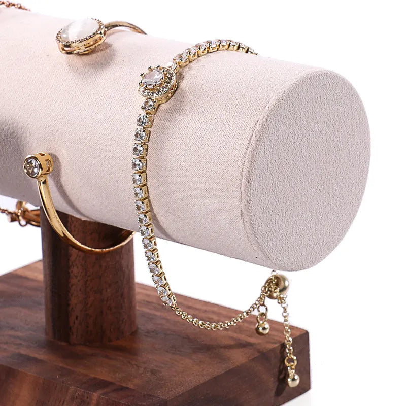 Walnut bracelet display stand with solid wood frame and beige velvet cushion